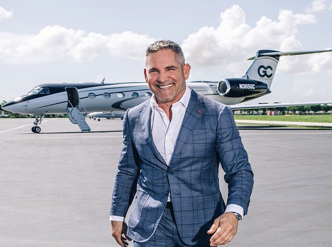 The image features a man dressed in a suit, standing next to an airplane with the words "G" and "C" written on its tail. The man appears to be smiling for the camera while posing near the plane. In the background of the photo, there is another airplane visible, which could potentially be related to the post's content about Bitcoin.