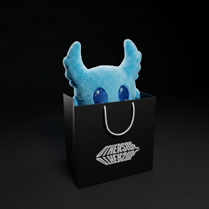 The image features a black shopping bag with a blue plush toy inside of it. The bag has white text that reads "OthersideAliens" written on it, indicating that this item was purchased from an online store called @phygitals.com/whitelabel/koda and is now available for free distribution via the post. A user named @retweettag has won a plush toy in the competition, and they are encouraged to share their experience with others by tagging them on social media using the hashtag #othersidealeways.