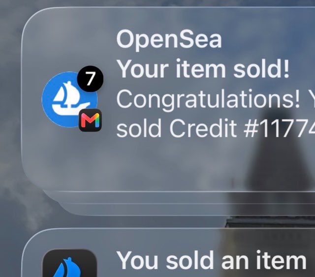 A smartphone notification from OpenSea displaying 'Your item sold! Congratulations! Y sold Credit #11774' with 7 unread Gmail notifications.
