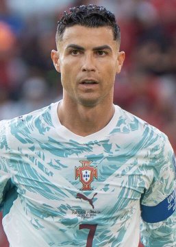 Cristiano Ronaldo is pictured wearing the Portugal national team jersey with the number 7 and captain's armband, connecting to the post about his ownership of Almeria in La Liga 2, which will face Messi's newly acquired Eldense on May 2, 2027.