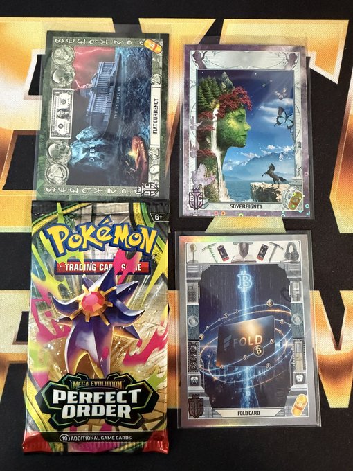 The image shows four Pokemon trading cards, each with different designs and colors, placed together on a black surface. The cards are neatly arranged in a row, showcasing their unique features. The text "Time for another #giveaway! For those who love @fold_app" suggests that the cards might be related to the popular mobile game Fold Art or a similar concept. The post also mentions Bitcoin and the hashtag #btc_cards, which could potentially be related to the trading card collection as well.