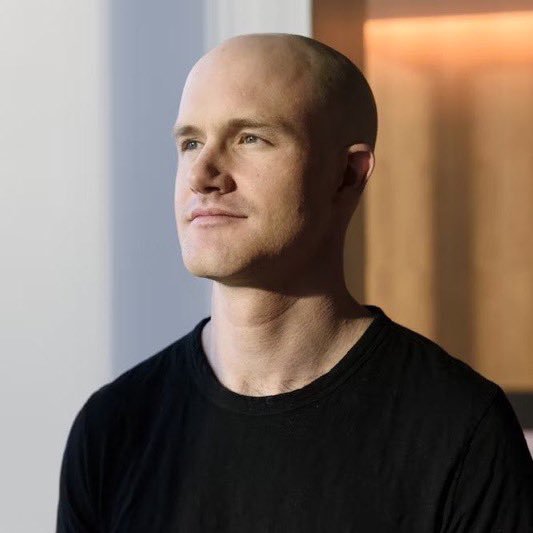 Brian Armstrong, the CEO of Coinbase, gazes thoughtfully into the distance, reflecting on his bold prediction that Bitcoin could soar to $300K–$400K by 2030.