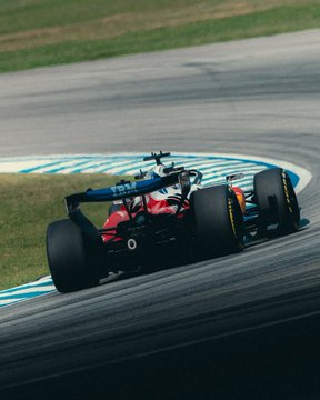 A red Ferrari Formula 1 car races through a corner on a track, with "POLARIS" and "ORLEN" sponsor logos visible on the bodywork, capturing the high-speed intensity of a qualifying session that ties into the post's excitement about Ferrari's performance.