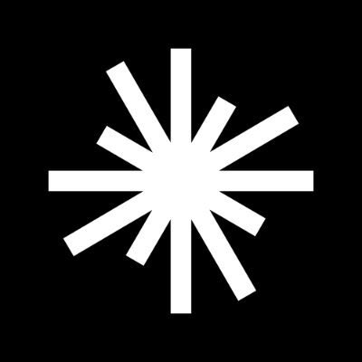 A simple white asterisk or starburst symbol centered on a solid black background.