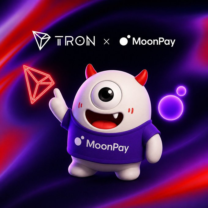 A promotional graphic for a TRON x MoonPay collaboration featuring a cute white one-eyed monster mascot wearing a purple MoonPay shirt, set against a swirling purple and red background.