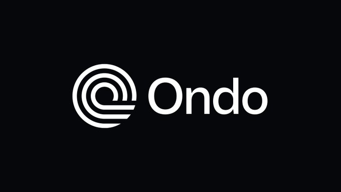 The Ondo logo is displayed on a black background, featuring its distinctive white circular maze-like emblem next to the company name in clean typography. This branding ties directly to the post highlighting Ondo's milestone of surpassing $97M in 24-hour trading volume for the $ONDO token.