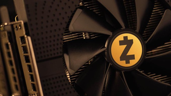 A close-up view of a computer cooling fan with a 'Z' logo on the center hub, tinted with an orange hue.