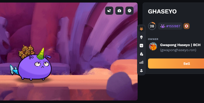 The image shows a cartoon character with purple fur, wearing a party hat, sitting next to a pink background that appears to be a lava lamp or lava pit. The character has a small toy boat floating nearby. In the top right corner of the image, there is text that reads "Ghaseyo" and "Gwapong Hasayo".