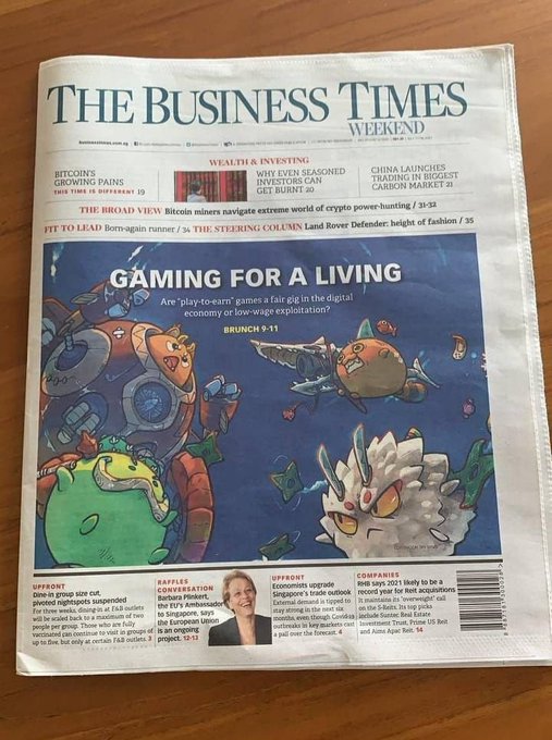 The front page of The Business Times Weekend newspaper featuring the headline 'GAMING FOR A LIVING' with colorful cartoon monster illustrations, alongside stories on Bitcoin miners, China's carbon market, and Barbara Pinkert.
