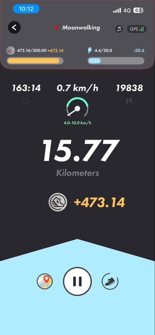 A smartphone fitness tracking screen displays a "Moonwalking" session in progress with a current speed of 0.7 km/h and 163:14 elapsed time, totaling 15.77 Kilometers and +473.14 energy earned. The image relates to the post as it shows the user is participating in the #STEPNathon challenge, taking a break at the 15.77 km mark on their way to the "21 kilometer" goal mentioned.