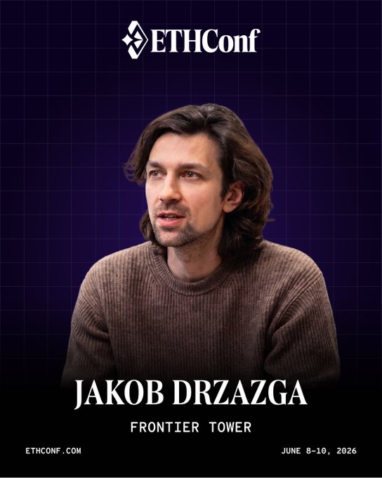 The image features a man with long hair wearing a brown sweater sitting down and looking off into the distance. The background of the image is purple, which contrasts with the man's brown sweater. There are also some text elements present in the image that read "@jakobbb_" and "@frontiertower".