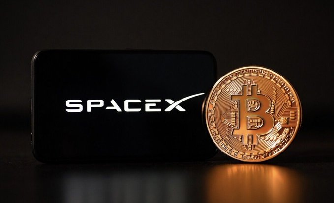 The image features a large golden coin with the word "Spacex" written on it, placed next to a black smartphone. The caption of the image reads: "$1 million buys 15.7 $BTC or 6,000 $SPCX What is your next move?". This suggests that someone has purchased the Spacex coin for a significant amount of money and is now contemplating their next steps with the coin.