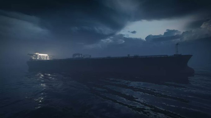 A dark, atmospheric scene shows a large cargo ship illuminated by its own lights sailing on dark waters under a stormy night sky.
