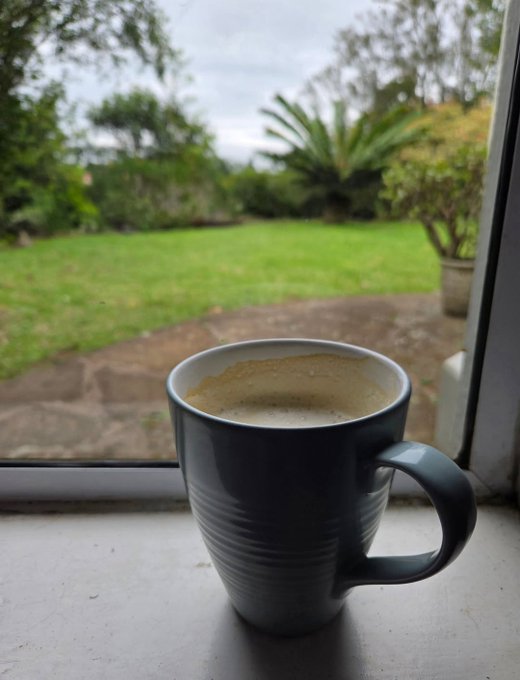 The image features a cup of coffee sitting on a windowsill or ledge outside. The cup has a handle and appears to be empty. The background shows an outdoor scene with grass, trees, and bushes, suggesting that the location could be a garden or patio area. The photo is captioned "GM legends New week, new month, new chances so what we are buying", which implies that there might have been some recent purchases or events in the person's life.

The image seems to be related to the post about GM Legends because it features an empty cup of coffee on a windowsill, and the caption suggests that someone has recently made a purchase from GM Legends. The outdoor setting with grass, trees, and bushes adds a sense of relaxation or leisure time, which could be associated with enjoying a hot beverage like coffee in a comfortable environment.