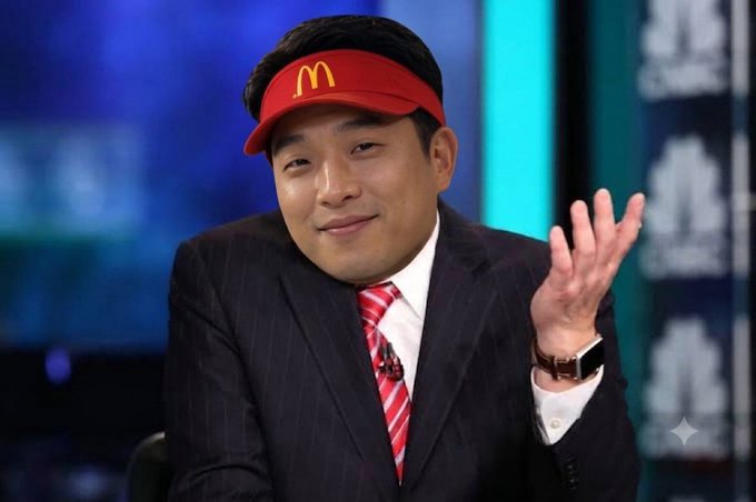 A man in a suit and red McDonald's visor smiles and waves at the camera during what appears to be a television appearance. The image serves as a humorous or promotional visual accompanying a post about a BitMine 8-K disclosure discussing estimated ETH purchases and potential stock buybacks.