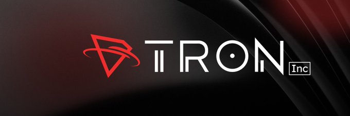 The red and white corporate logo for 'TRON Inc' displayed against a dark, textured background.
