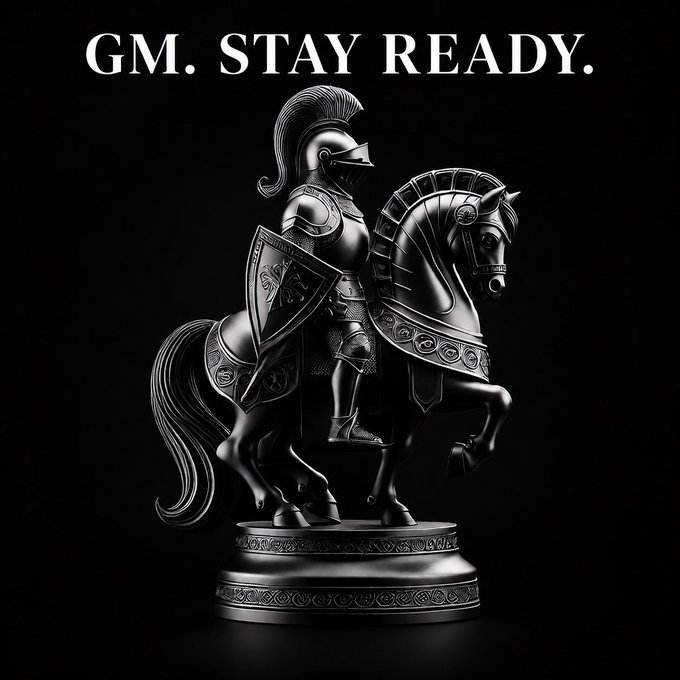 A knight in armor rides a rearing horse atop an ornate pedestal, with the bold text "GM. STAY READY." displayed above, symbolizing the readiness and perseverance the post encourages for the new week while highlighting the projects $STKR and @MemeMilitiaNFT.