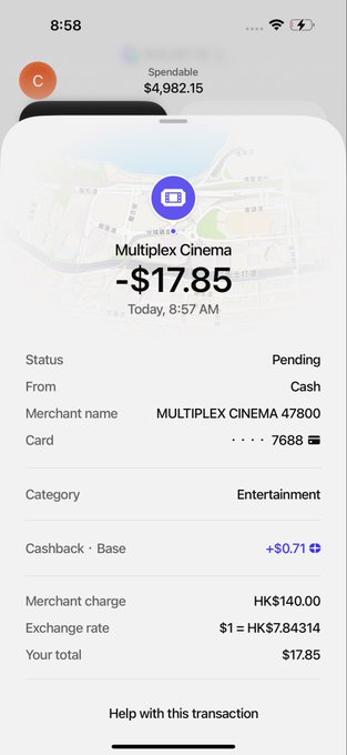 A screenshot of a transaction notification showing a $17.85 purchase at "MULTIPLEX CINEMA" with a +$0.71 cashback reward, demonstrating the advertised 0 fees and cashback benefit on a $140 HKD charge converted at an exchange rate of $1 = HK$7.84314.