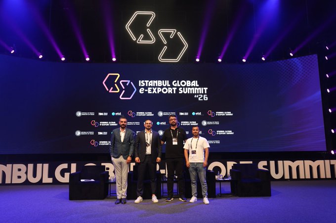 Four men stand on stage at the 'ISTANBUL GLOBAL e-EXPORT SUMMIT '26' event, with logos for 'TIM', 'etsid', and others visible on the large screen behind them.