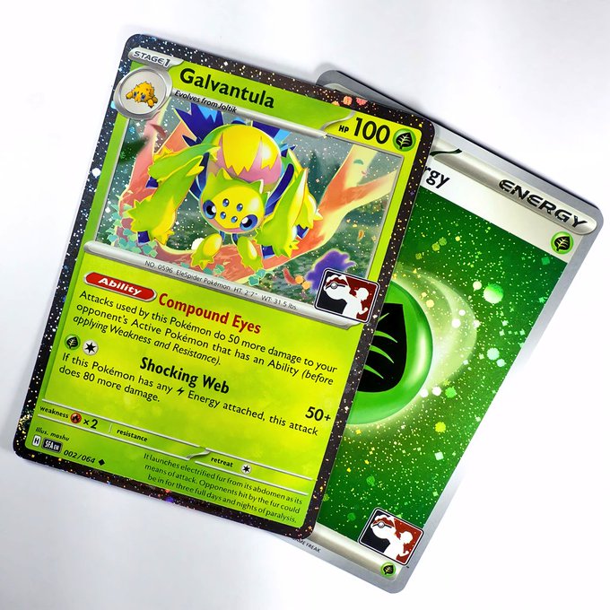 A Galvantula Pokémon trading card (Stage 1, 100 HP) with the "Compound Eyes" ability and "Shocking Web" attack, displayed alongside a Grass Energy card on a green splatter background.