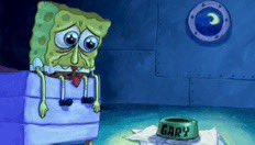 A sad-looking SpongeBob SquarePants sitting on a bed in a dark room with a porthole window, with the word 'BABY' visible on the blanket.