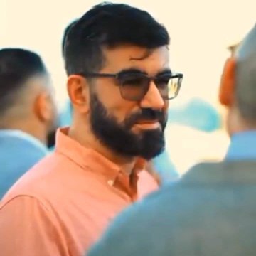 The photo shows a bearded man in glasses and a pink/salmon shirt, appearing to engage in conversation at what the post describes as a professional networking event. The image aligns with the caption's theme of Pi Network's founders, Dr. Nicolas Kokkalis and Dr. Chengdiao Fan, networking with industry professionals beyond the crypto space.