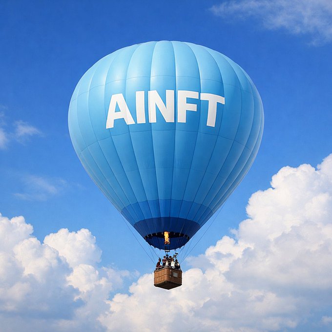 A blue hot air balloon with the text "AINFT" emblazoned on its side floats gracefully in a partly cloudy sky, with passengers visible in the basket below. The image visually reinforces the post's message of AINFT "evolving beyond" by symbolizing the platform's ascent and forward momentum in the AI and blockchain space.