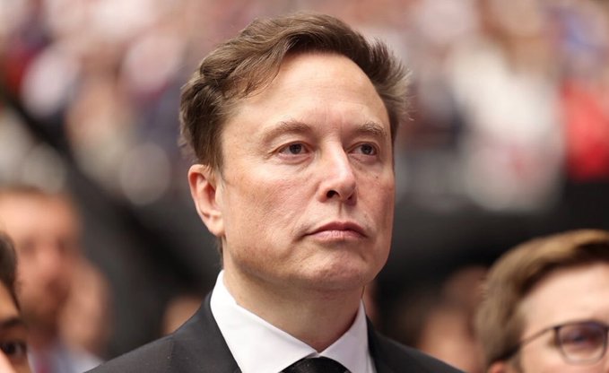 The image shows an older man wearing a suit and tie standing among a crowd of people at a social event or gathering. The man appears to be deep in thought, possibly contemplating Bitcoin's future. The surrounding crowd consists of various individuals engaged in conversations and interactions with one another.