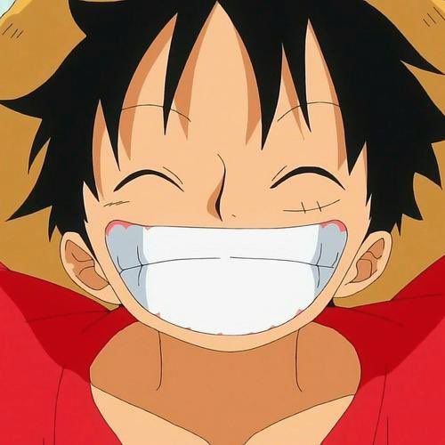 An animated close-up of Luffy from One Piece smiling broadly with his mouth wide open, wearing his signature red shirt.