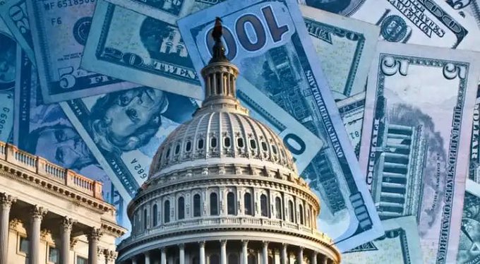 The U.S. Capitol dome is superimposed over a background of overlapping $5, $10, $20, $50, and $100 bills, visually reinforcing the post's message that government spending and money printing undermine Americans' financial future.