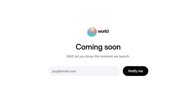 The image shows a "Coming soon" landing page with the World logo, displaying the text "We'll let you know the moment we launch" alongside an email signup field and a "Notify me" button. This relates to the post about potential World (world_xyz) TGE developments on Solana, as the landing page teases an upcoming launch announcement.