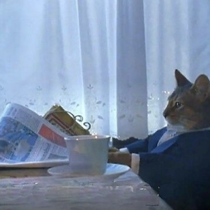 A humorous composite image of a cat in a blue suit with paws on a table, appearing to read a newspaper while a teacup sits nearby.