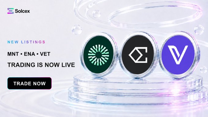 Promotional graphic for Solcex exchange announcing 'NEW LISTINGS MNT, ENA, VET TRADING IS NOW LIVE' with a 'TRADE NOW' button, displaying three circular coin tokens on a glass pedestal.