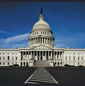 The U.S. Capitol Building stands prominently under a clear blue sky, symbolizing the ongoing legislative process behind the CLARITY Act as it moves through the Senate ahead of the August 7 deadline.