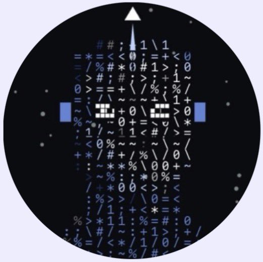 A circular pixel art design depicting a face or skull formed entirely from various typographic symbols, punctuation marks, and ASCII characters in blue and white against a black background.