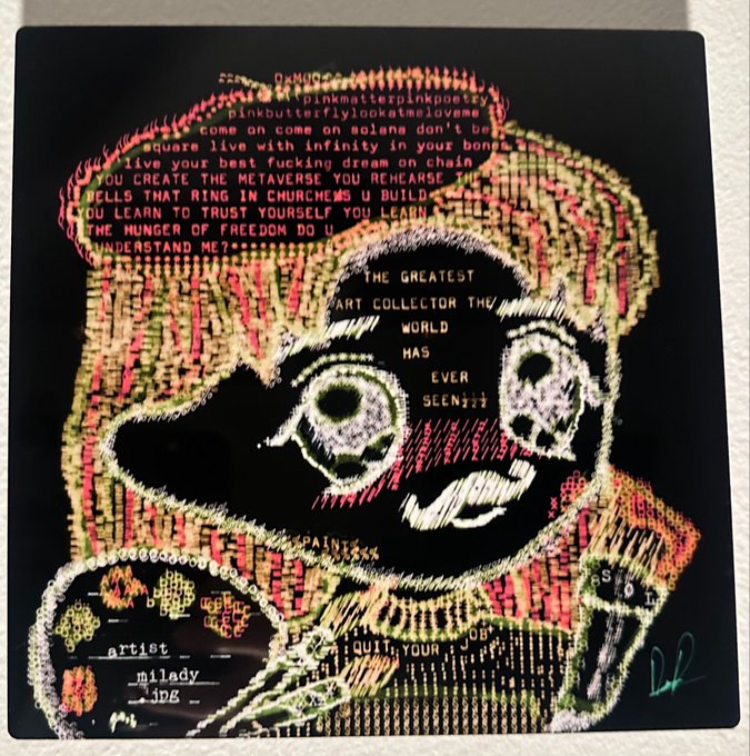 A digital glitch-art style portrait features a pixelated, distorted face overlaid with colorful text fragments including 'the greatest art collector the world has ever seen???', 'pinkmatterpinkpoetry', and 'square live with infinity in your bones'.