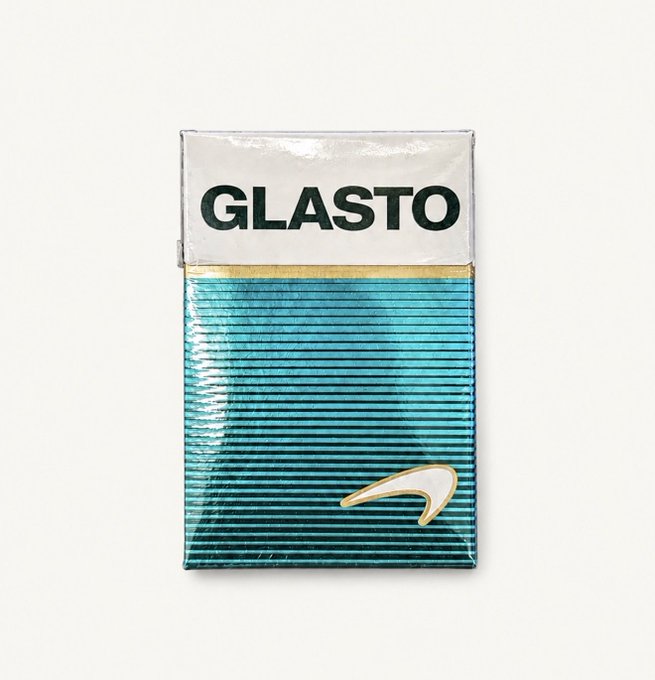 A teal and white cigarette-style pack with the text 'GLASTO' at the top and a small gold emblem below.