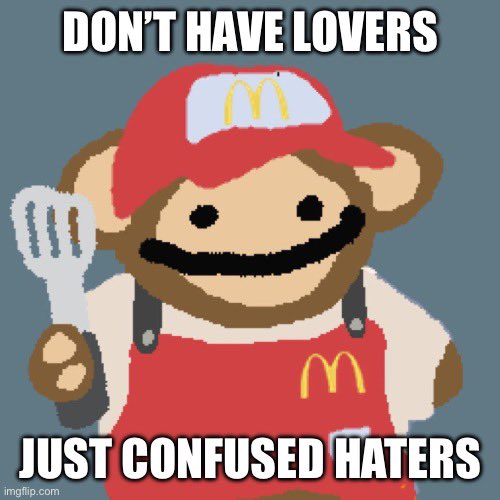 A meme image of a cartoon bear mascot wearing a McDonald's uniform and hat, holding a spatula, with text reading "DON'T HAVE LOVERS" at the top and "JUST CONFUSED HATERS" at the bottom.