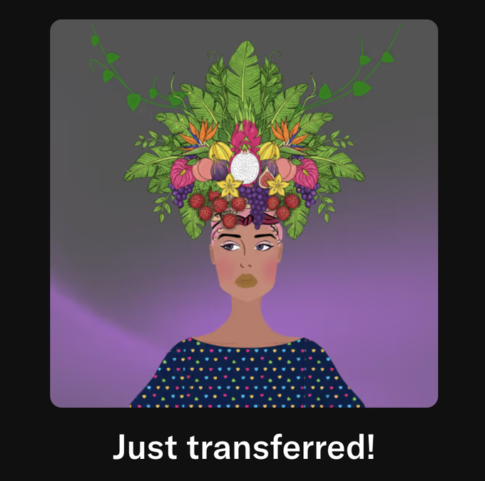 A stylized digital illustration of a woman with an elaborate headdress made of tropical fruits, leaves, and flowers, with the text 'Just transferred!' below.
