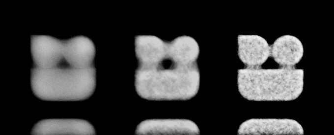 A grainy, black-and-white image displaying a grid of blurry, textured shapes resembling simple faces or bear-like icons on a dark background.