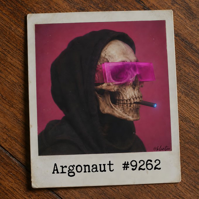 A Polaroid-style photograph featuring a skull wearing a black hood and pink sunglasses while smoking a cigarette, labeled 'Argonaut #9262' at the bottom.