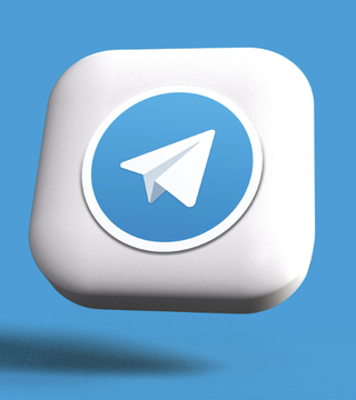 The image features a square-shaped white object with a blue circle on top, which has the word "Telegram" written inside of it. The background color of the image is blue, and there are some words that read "Just In: Telegram founder Pavel Durov announced that Telegram's $TON coin will be rebranded as GRAM." This text is located at the bottom right corner of the image.