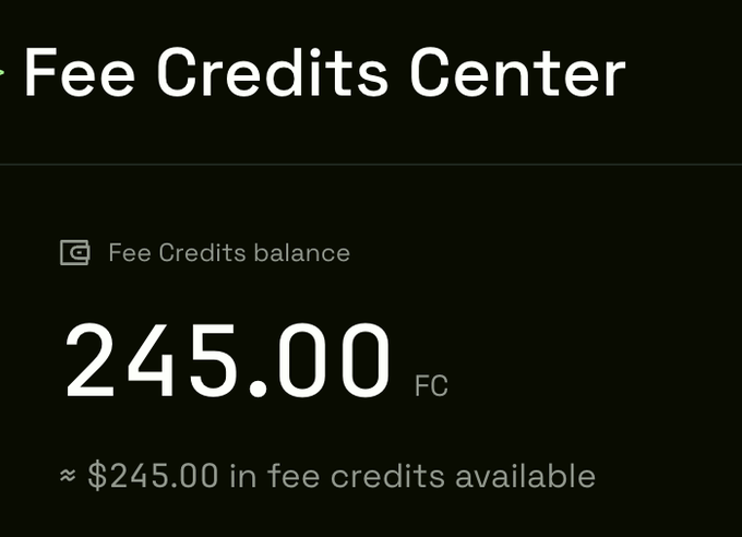 A screenshot of a "Fee Credits Center" page showing a Fee Credits balance of 245.00 FC, equivalent to approximately $245.00 in fee credits available, confirming the automatic reward distribution mentioned in the post.