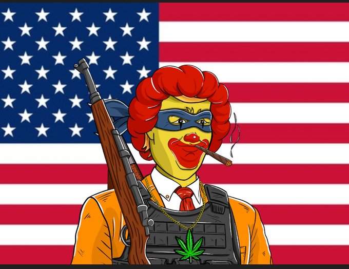 A cartoon clown character dressed as a mercenary with a rifle, tactical vest, and cannabis necklace stands in front of an American flag.
