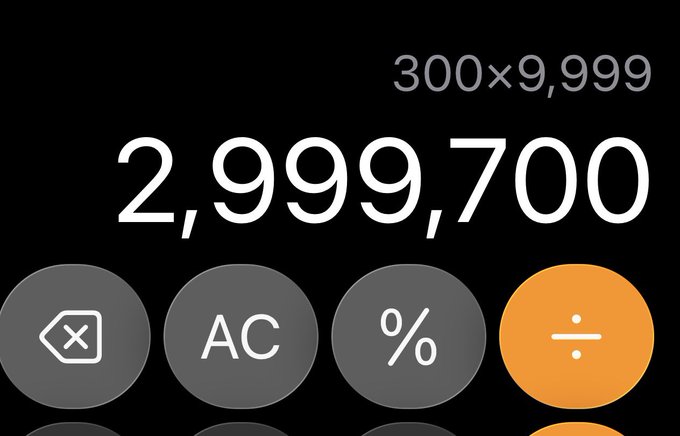 A smartphone calculator app displays the calculation '300×9,999' resulting in '2,999,700' against a black background.