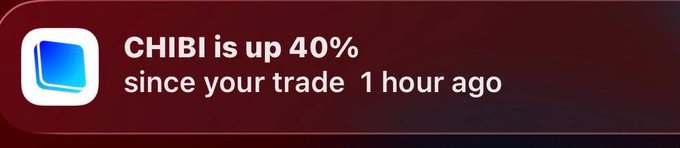A mobile notification alert from a trading app indicating 'CHIBI is up 40% since your trade 1 hour ago' on a dark red background.