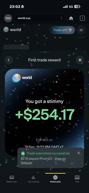 A mobile screenshot from world.xyz showing a 'First trade reward' of +$254.17 earned, with a confirmation that the trade was submitted successfully, and Vietnamese navigation tabs at the bottom.