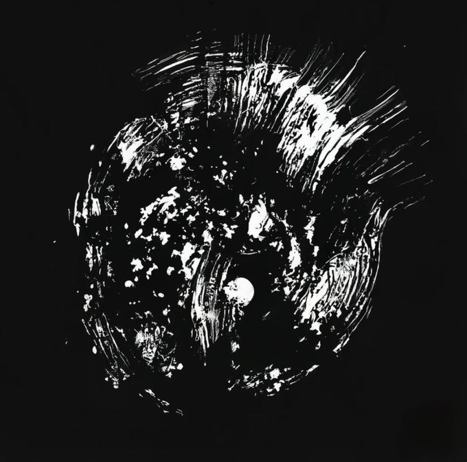 Black and white abstract artwork featuring a circular, brushstroke-like pattern with splatter effects resembling a cosmic or galaxy formation.