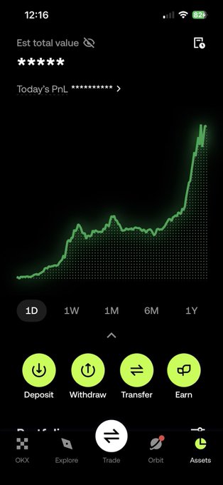 A mobile crypto trading app (OKX) showing an upward-trending green portfolio chart, currently displaying the 1D timeframe with options for Deposit, Withdraw, Transfer, and Earn.