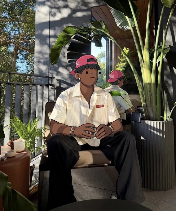 An illustrated figure with a cartoon face filter sits on an outdoor patio chair holding a white cup, wearing a white short-sleeved shirt and pink cap, surrounded by tropical plants.